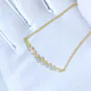Yellow gold partial graduated moissanite necklace with front view