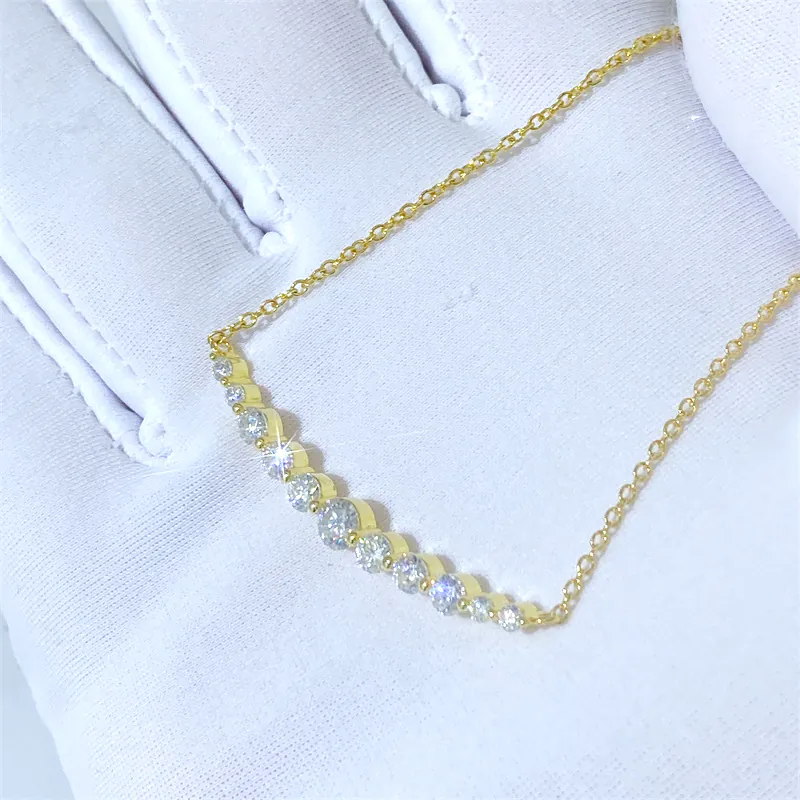 Yellow gold partial graduated moissanite necklace with front view