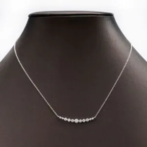 Moissanite partial graduated necklace shown on model