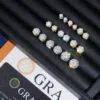 Front view of multiple sizes of six-prong moissanite stud earrings