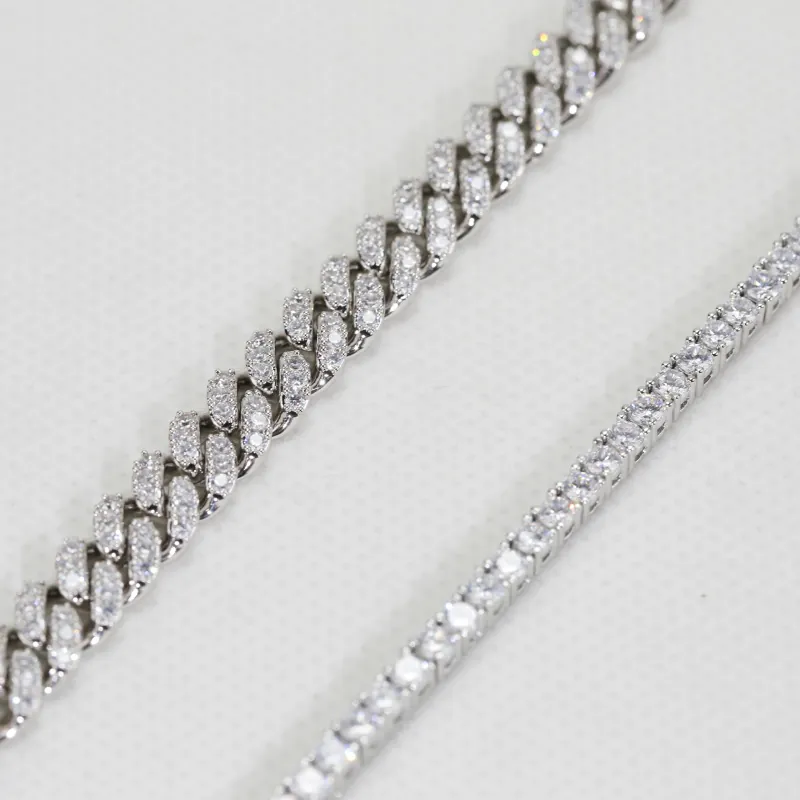 close-up detail of brass iced out cuban and tennis chain clasp and CZ stone sparkle